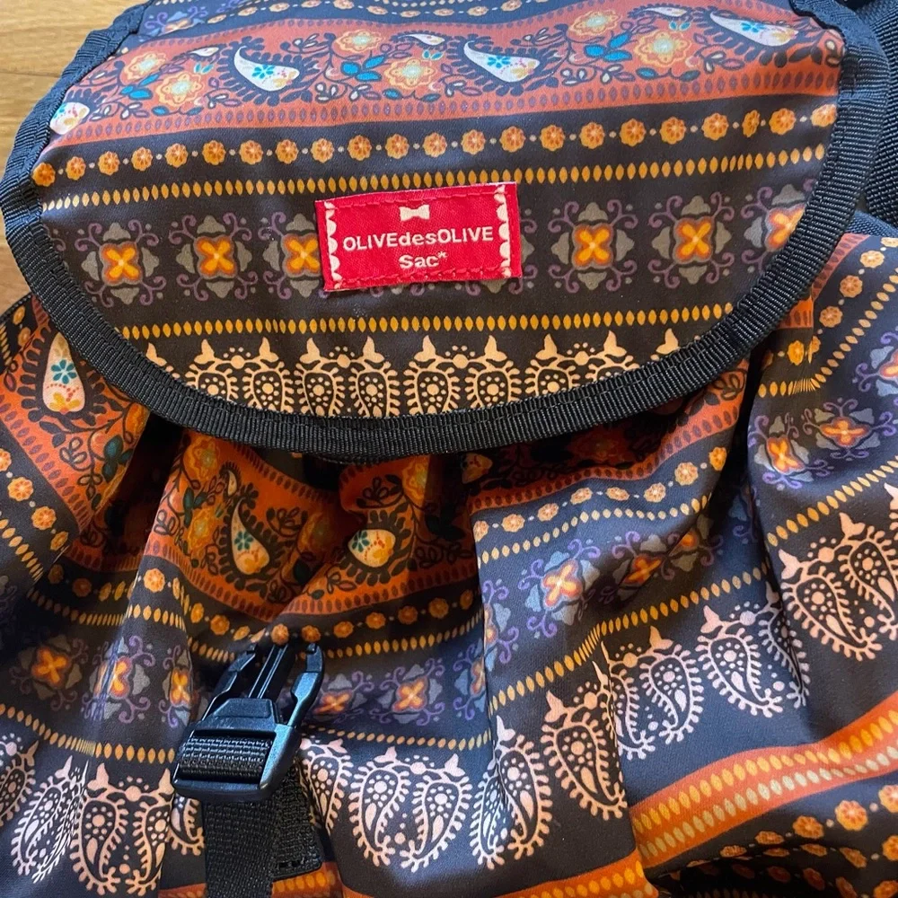 Olive Des Olive nylon drawstring adjustable strap backpack in EUC/Fall colors!